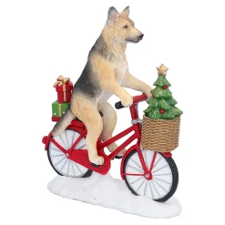Standfiguren-Schäferhund auf Fahrrad